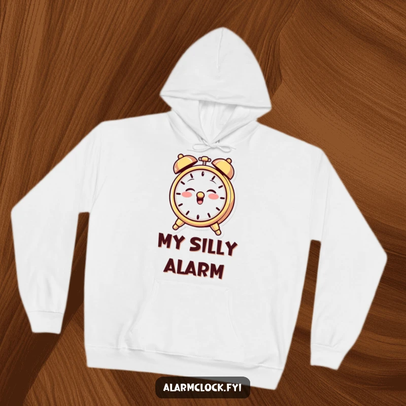Funny hoodie featuring a giggling alarm clock character with a mischievous grin, playfully ringing its bell, perfect for cozy, playful days.