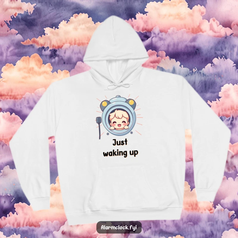 Funny hoodie featuring a smiling character peeking from behind a giant, blaring alarm clock, offering a humorous and cozy vibe.